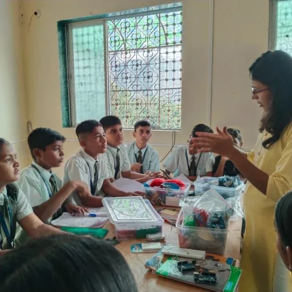 Students using CodersPride platform with robotics kits
